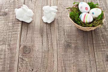 Basket with easter eggs and easter bunnies