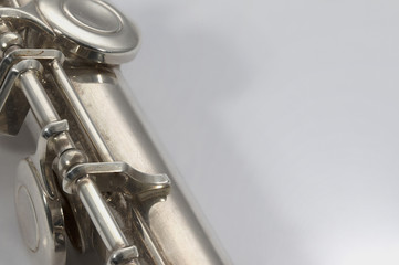 keys section of flute on plain background