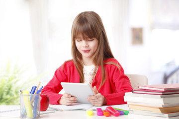 Little girl with digital tablet