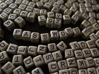 cubes with letters on a black background, with the word password