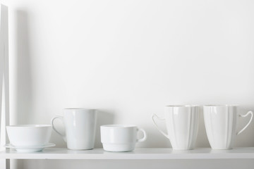 Clean dishes on wooden shelf