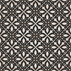 Decorative seamless golden texture on dark background.
