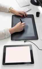Woman hands using a graphics tablet