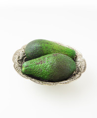 Avocado in silver plate