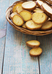 crackers in a basket on  old  blue wooden background