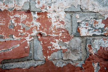 Old weathered wall painted red