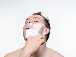 Man shaves shaving foam