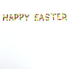 Happy Easter / Happy Easter sign made of colour lentil candies