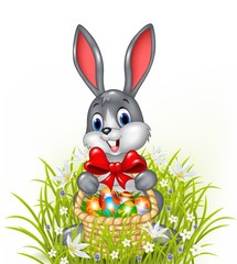 A Easter bunny with a basket of painted Easter eggs
