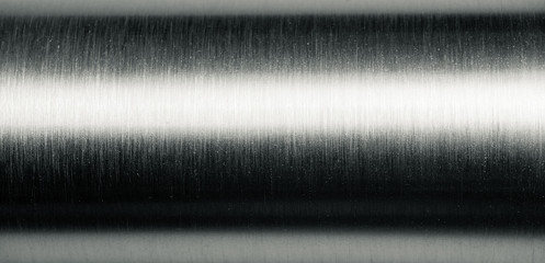 Shiny brushed metal pipe surface