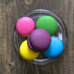 Colorful macaroons  on wooden background