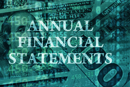 Words Annual Financial Statements  with the financial data on the background. 