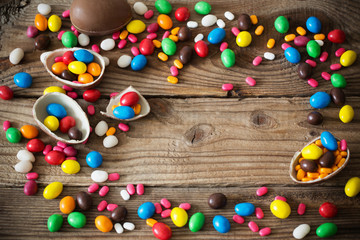 Fototapeta na wymiar Chocolate Easter Eggs Over Wooden Background