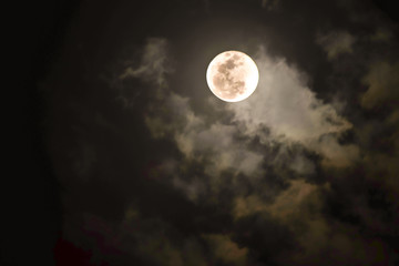 Fototapeta na wymiar Full Moon at night A cloud passed over