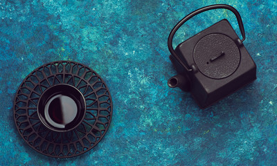 Asian tea set. Cast iron teapot and cup tea in vintage style