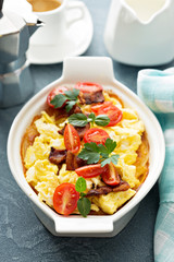 Baked potatoes with cheese sauce and eggs