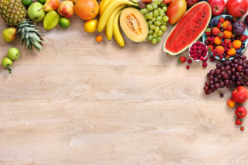 Healthy fruits background / studio photo of different fruits on wooden table