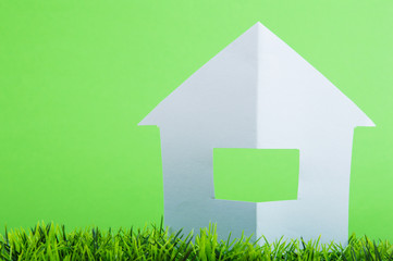 eco house made of paper on green grass