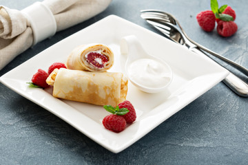 Crepes filled with cottage cheese and raspberry
