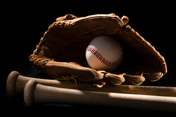 Baseball equipment on black