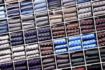 Silk neckties on shelves in a store