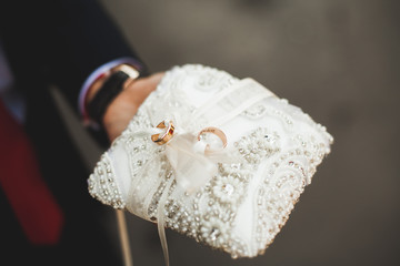 Luxurious rings in the church. Wedding ceremony