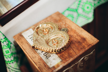 Luxurious rings in the church. Wedding ceremony