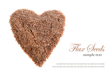 Raw flax seeds linseed heart shaped isolate in white background with text. Healthy food for preventing heart diseases.