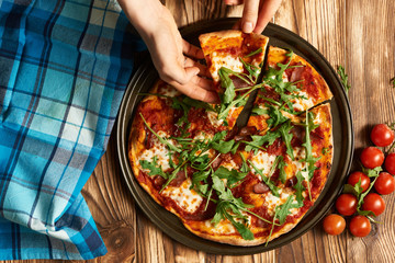 Home made pizza on wooden table