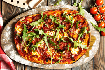 Home made pizza on wooden table