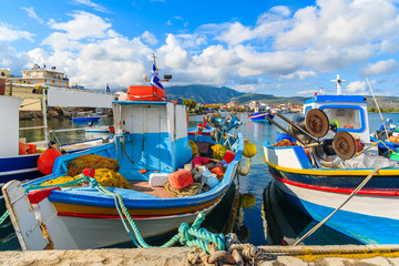 Fototapeta na wymiar Colorful typical Greek fishing boats in port on Samos island, Greece