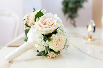 Beautiful bride's bouquet on the table in registry office