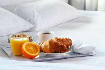 Breakfast in bed in hotel room. - obrazy, fototapety, plakaty