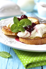 French toasts with ricotta and cherry syrup.
