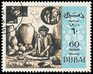 Stamp printed in the Dubai shows scene by Omar Khayyam