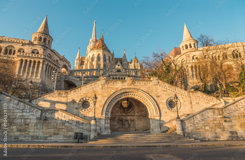 Wall mural Sunlit Fisherman's Bastion in Budapest, Hungary at Sunrise. View from below. - Wall murals