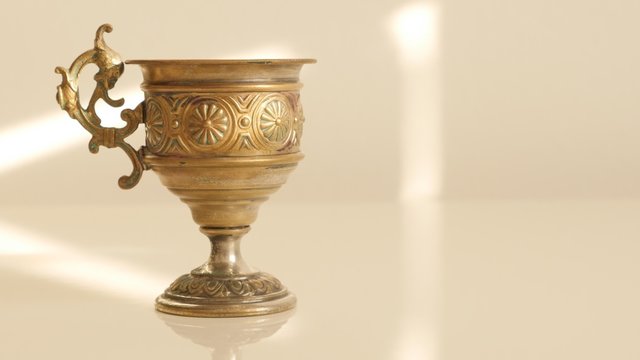 Hand made brass holy grail style highly detailed 4K 2160p UltraHD tilting footage