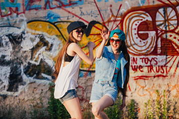 Fototapeta premium two funny and happy street girls