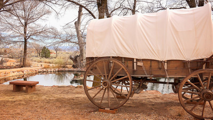 Covered Wagon Sits Next to Natural Spring Water