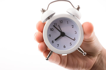 Alarm clock in hand