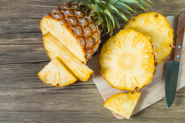 pineapple on the wood texture background