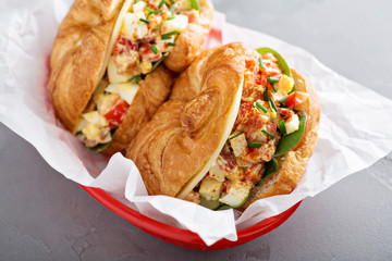 Croissant sandwich with egg salad and spinach