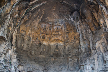 Buddha sculpture on cave wall in Longmen Grottoes Longmen Caves