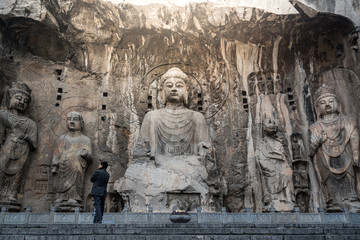 Buddha sculpture on cave wall in Longmen Grottoes Longmen Caves