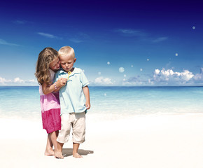 Fototapeta na wymiar Summer Beach Family Fun Children Playful Concept