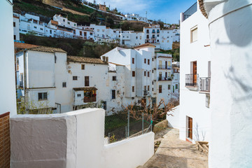 Fototapeta premium Setenil de las Bodegas is a town in the province of Cadiz, Spain, famous for its dwellings built into rock overhangs above the Rio Trejo. Andalusia. Spain