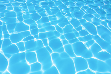 Fototapeta na wymiar Beautiful gentle wave in swimming pool with sun reflection