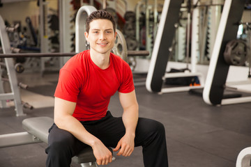 Fototapeta na wymiar Attractive Hispanic young man at a gym