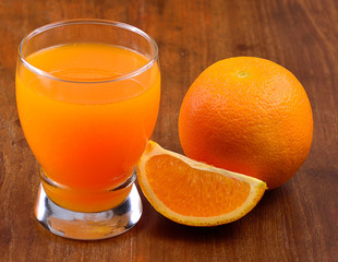 Orange juice  isolated on a wooden background