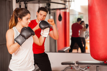 Attractive brunette boxing at the gym